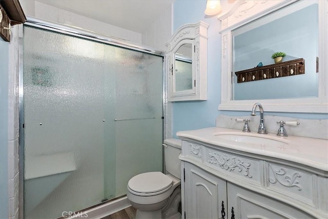 145 Cumberland Dr, Lake Arrowhead, CA 92352 - bathroom with a stall shower, toilet, and vanity