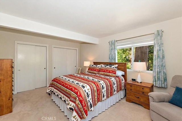 145 Cumberland Dr, Lake Arrowhead, CA 92352 - bedroom featuring carpet floors and two closets