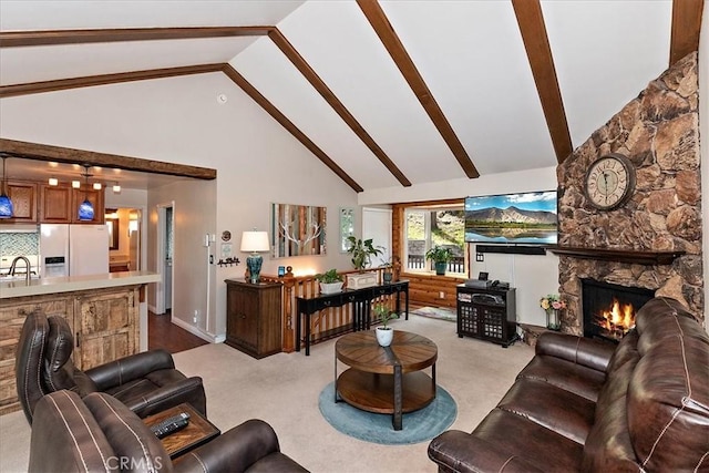 145 Cumberland Dr, Lake Arrowhead, CA 92352 - living area with high vaulted ceiling, beam ceiling, a stone fireplace, and light colored carpet