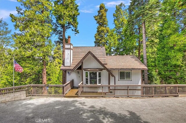 145 Cumberland Dr, Lake Arrowhead, CA 92352 - view of front of property with a chimney and a wooden deck