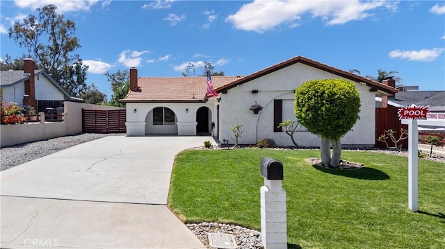 19927 Athenon Ave, Perris, CA 92570 - mediterranean / spanish home with concrete driveway, stucco siding, a chimney, and a tiled roof