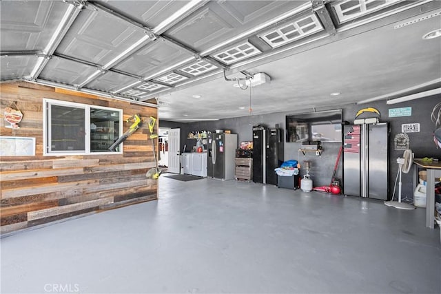 19927 Athenon Ave, Perris, CA 92570 - garage with wooden walls and stainless steel fridge with ice dispenser