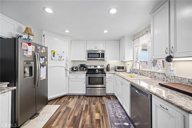 19927 Athenon Ave, Perris, CA 92570 - kitchen featuring stainless steel appliances, a sink, white cabinets, dark wood finished floors, and recessed lighting
