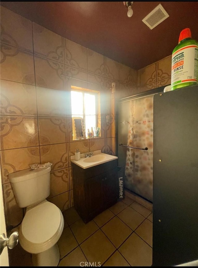 309 N Willowbrook Ave, Compton, CA 90220 - bathroom with tile patterned floors, vanity, and toilet