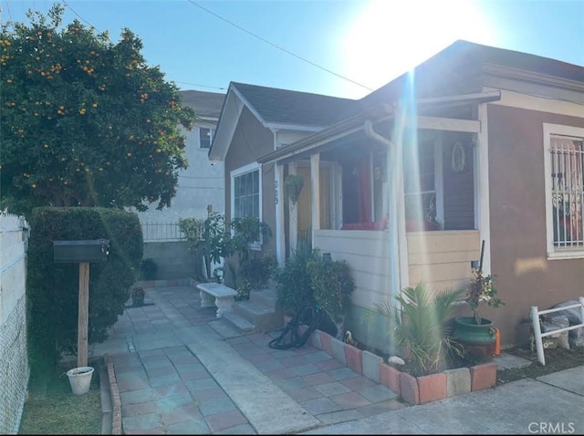 309 N Willowbrook Ave, Compton, CA 90220 - view of side of property with a patio area and stucco siding