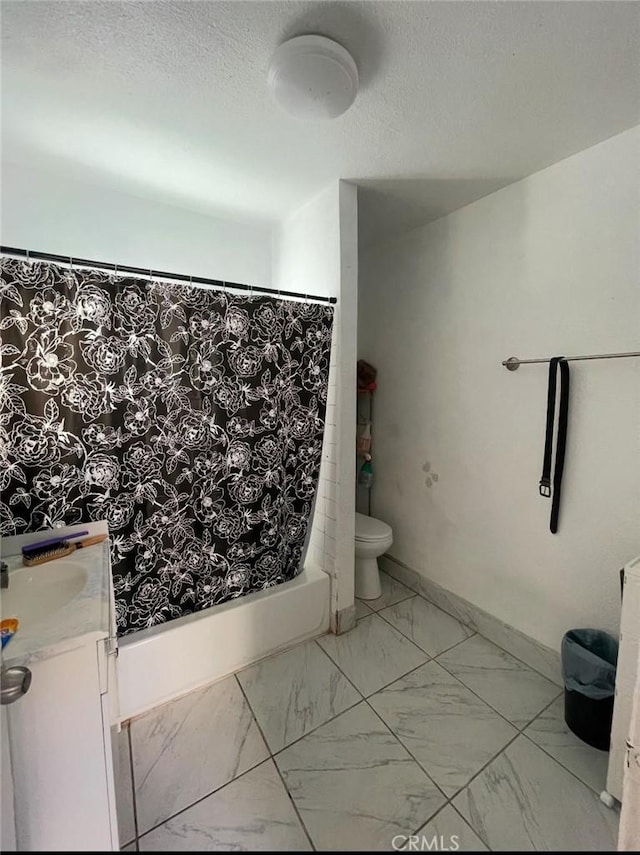 309 N Willowbrook Ave, Compton, CA 90220 - bathroom featuring vanity, toilet, shower / tub combo with curtain, marble look tile flooring, and a textured ceiling