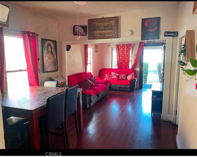 309 N Willowbrook Ave, Compton, CA 90220 - dining area with a textured ceiling, hardwood / wood-style flooring, healthy amount of natural light, and a wall unit AC