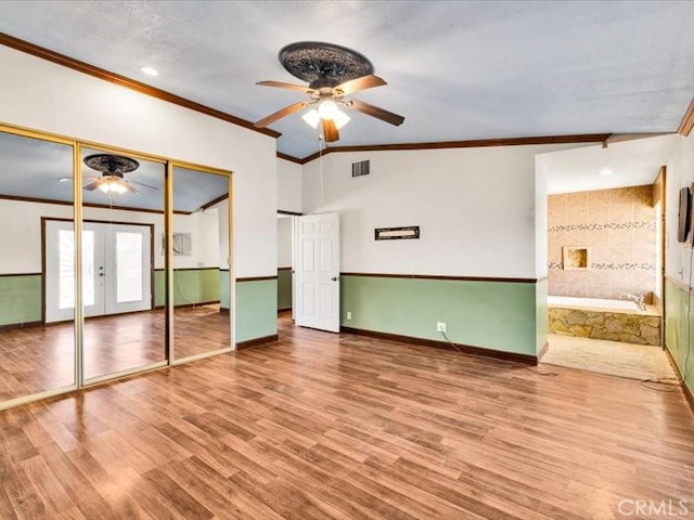 4689 Stirrup Ln Unit 29, Palms, CA 92277 - unfurnished bedroom with ornamental molding, wood finished floors, french doors, baseboards, and ceiling fan