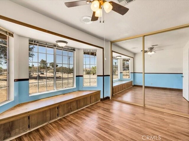 4689 Stirrup Ln Unit 29, Palms, CA 92277 - interior space featuring wood finished floors, a ceiling fan, and baseboards