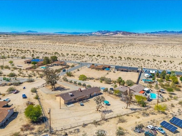4689 Stirrup Ln Unit 29, Palms, CA 92277 - aerial view of sparsely populated area featuring a desert landscape and a mountainous background