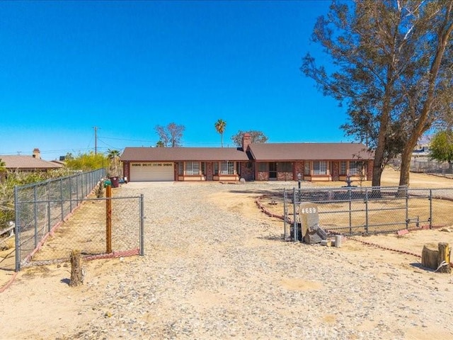 4689 Stirrup Ln Unit 29, Palms, CA 92277 - ranch-style house featuring a garage, dirt driveway, and fence