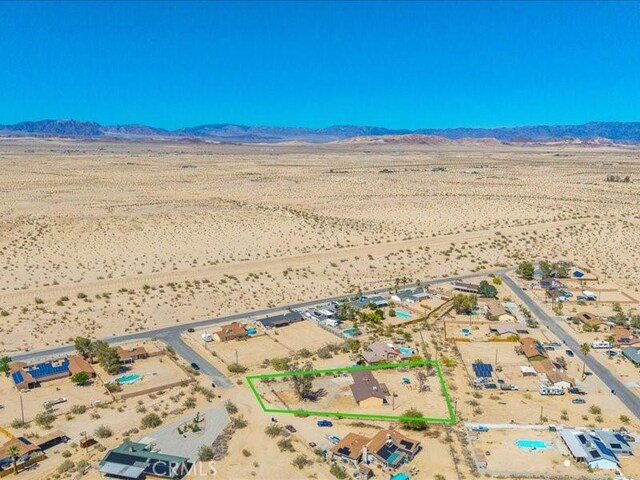 4689 Stirrup Ln Unit 29, Palms, CA 92277 - overview of rural landscape with a desert landscape, a mountainous background, and property boundaries highlighted