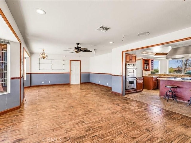 4689 Stirrup Ln Unit 29, Palms, CA 92277 - living room featuring baseboards, ceiling fan, light wood-style flooring, and recessed lighting