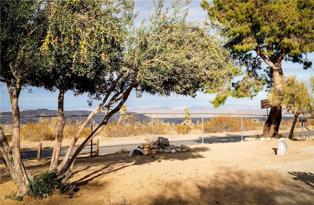 60515 Alta Loma Dr, Joshua Tree, CA 92252 - water view with fence and mountains