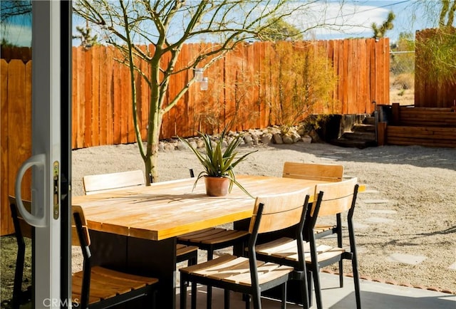 60515 Alta Loma Dr, Joshua Tree, CA 92252 - view of patio / terrace featuring fence and outdoor dining space