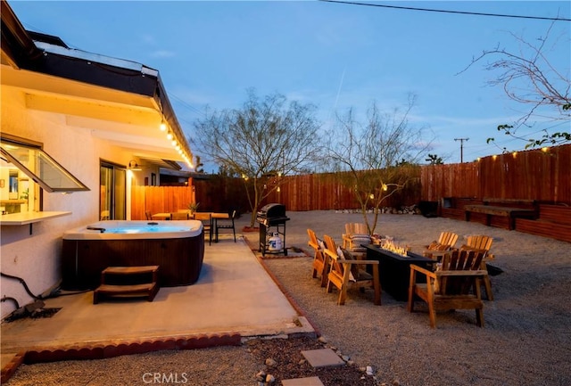 60515 Alta Loma Dr, Joshua Tree, CA 92252 - view of patio / terrace with a hot tub, a fire pit, a grill, and a fenced backyard