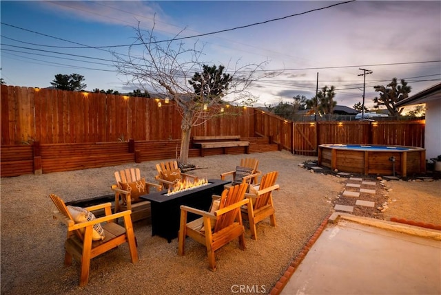 60515 Alta Loma Dr, Joshua Tree, CA 92252 - view of patio with an outdoor fire pit and a fenced backyard