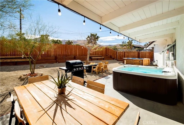 60515 Alta Loma Dr, Joshua Tree, CA 92252 - view of patio / terrace with outdoor dining space, a hot tub, a grill, and a fenced backyard