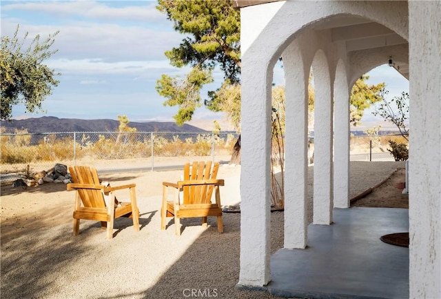 60515 Alta Loma Dr, Joshua Tree, CA 92252 - view of patio / terrace with a fenced backyard and a mountain view
