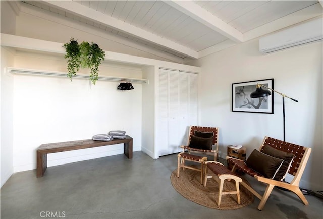 60515 Alta Loma Dr, Joshua Tree, CA 92252 - sitting room featuring finished concrete floors, a wall mounted AC, wooden ceiling, and baseboards