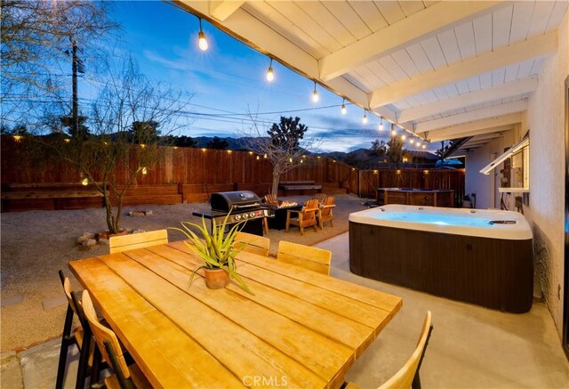 60515 Alta Loma Dr, Joshua Tree, CA 92252 - view of patio featuring a hot tub, a fenced backyard, area for grilling, and outdoor dining space