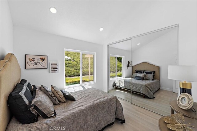 28412 Buena Vis, Mission Viejo, CA 92692 - bedroom with light wood-style floors, recessed lighting, a closet, and lofted ceiling