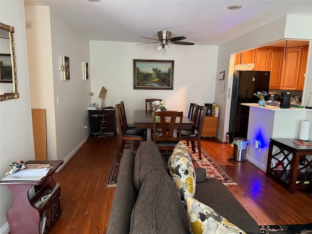 25779 Via Lomas Unit 170, Laguna Hills, CA 92653 - living area featuring dark wood-style floors, a ceiling fan, and baseboards