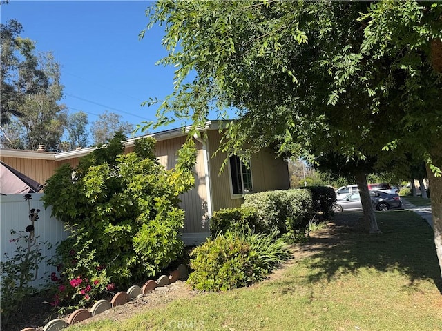 25779 Via Lomas Unit 170, Laguna Hills, CA 92653 - view of side of home featuring a lawn