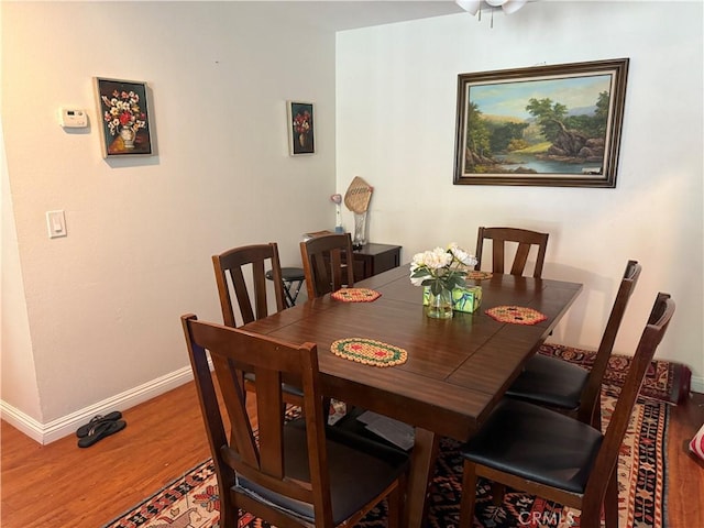 25779 Via Lomas Unit 170, Laguna Hills, CA 92653 - dining room with baseboards and wood finished floors