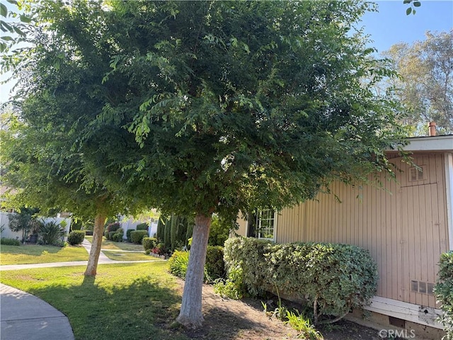 25779 Via Lomas Unit 170, Laguna Hills, CA 92653 - view of property exterior featuring a lawn and crawl space