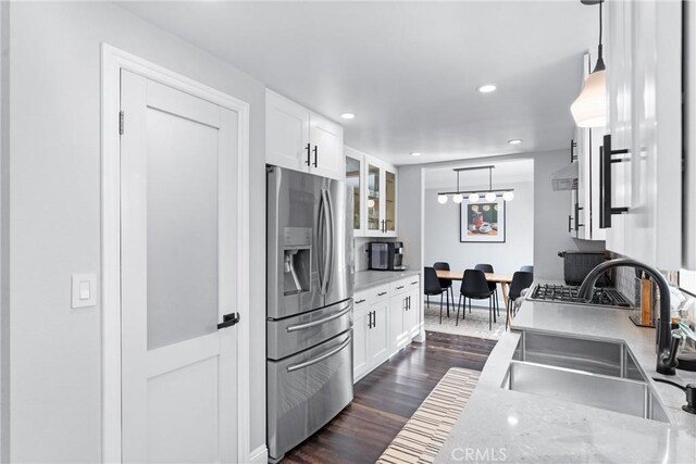 1421 Woodcrest Ave, Brea, CA 92821 - kitchen featuring stainless steel fridge, a sink, dark wood finished floors, white cabinetry, and recessed lighting
