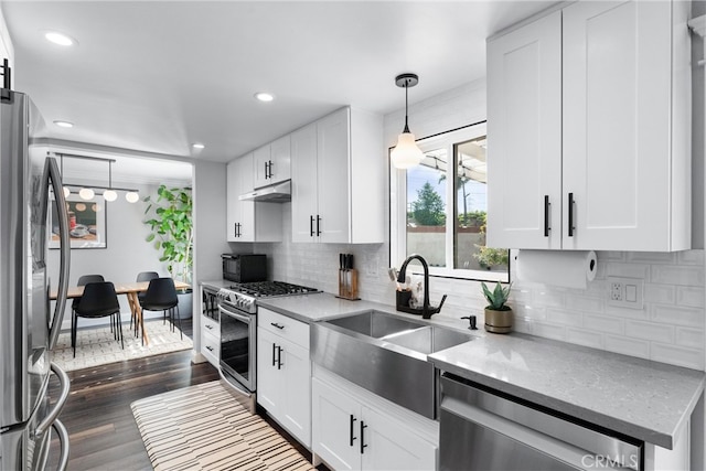 1421 Woodcrest Ave, Brea, CA 92821 - kitchen featuring appliances with stainless steel finishes, a sink, under cabinet range hood, white cabinetry, and light stone countertops
