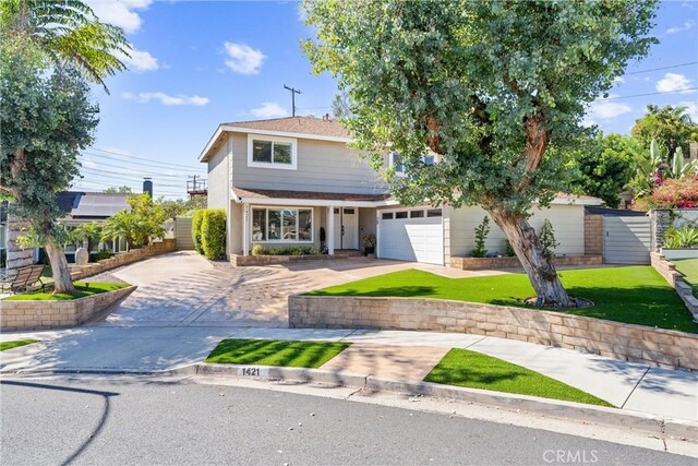 1421 Woodcrest Ave, Brea, CA 92821 - traditional home featuring concrete driveway, a garage, and a front lawn