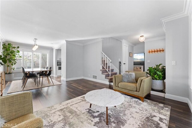 1421 Woodcrest Ave, Brea, CA 92821 - living area featuring stairway, wood finished floors, baseboards, and ornamental molding