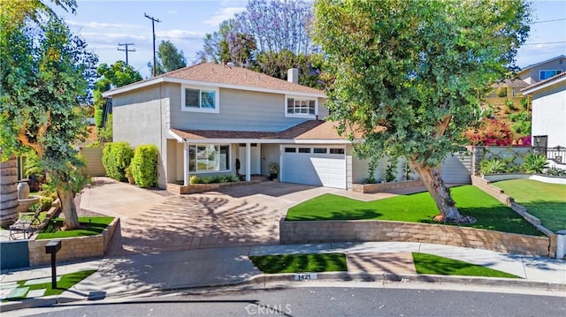 1421 Woodcrest Ave, Brea, CA 92821 - traditional-style house featuring asphalt driveway, roof with shingles, and a front lawn