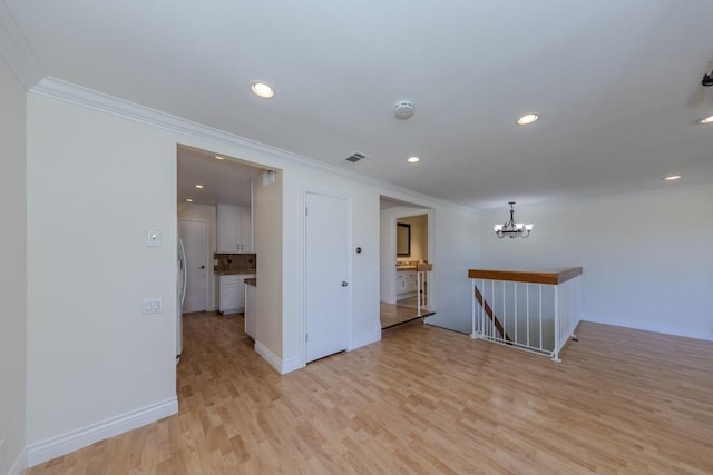23342 Caminito Juanico Unit 304, Laguna Hills, CA 92653 - unfurnished room featuring ornamental molding, light wood-style floors, recessed lighting, a chandelier, and a smoke detector
