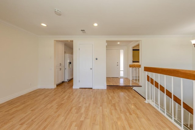 23342 Caminito Juanico Unit 304, Laguna Hills, CA 92653 - unfurnished room featuring crown molding, a smoke detector, light wood-type flooring, and recessed lighting