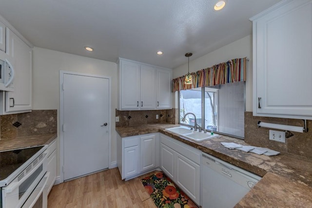 23342 Caminito Juanico Unit 304, Laguna Hills, CA 92653 - kitchen with dishwasher, white cabinetry, range with two ovens, decorative backsplash, and recessed lighting