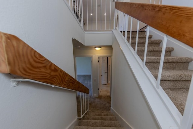 23342 Caminito Juanico Unit 304, Laguna Hills, CA 92653 - staircase with carpet and a high ceiling
