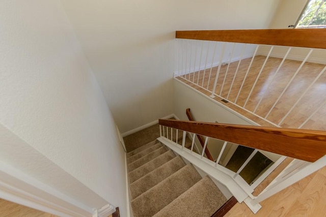 23342 Caminito Juanico Unit 304, Laguna Hills, CA 92653 - stairway featuring baseboards