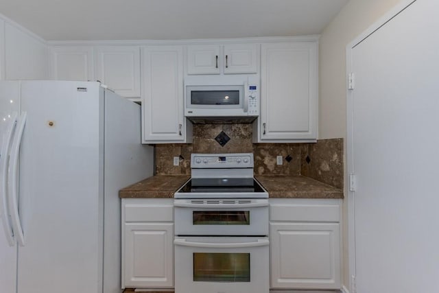23342 Caminito Juanico Unit 304, Laguna Hills, CA 92653 - kitchen featuring white appliances, dark countertops, white cabinetry, and backsplash