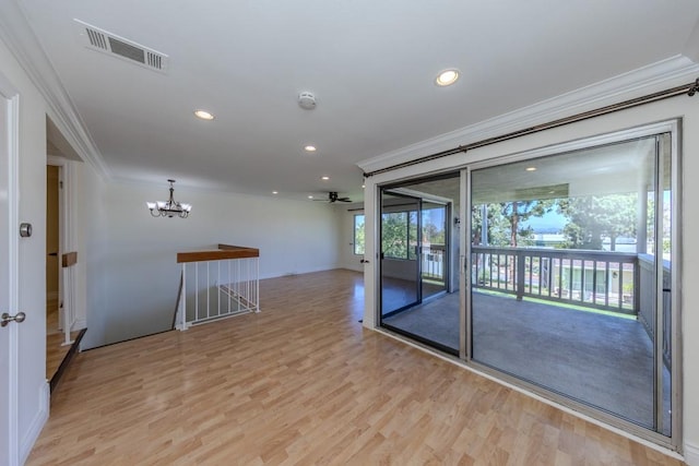 23342 Caminito Juanico Unit 304, Laguna Hills, CA 92653 - spare room featuring crown molding, light wood-style floors, a chandelier, recessed lighting, and a smoke detector