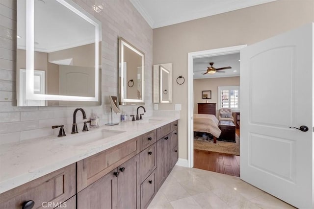 723 N Lucia Ave Unit A, Redondo Beach, CA 90277 - ensuite bathroom featuring ornamental molding, double vanity, decorative backsplash, ceiling fan, and baseboards