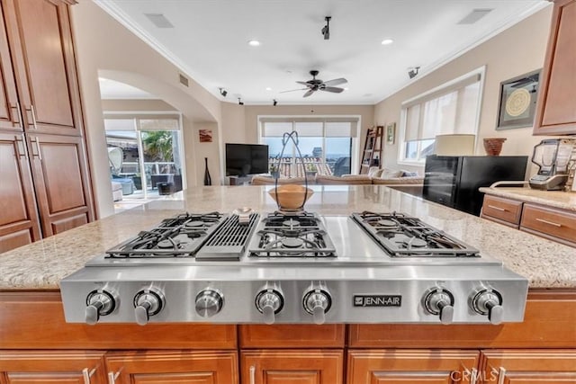 723 N Lucia Ave Unit A, Redondo Beach, CA 90277 - kitchen with open floor plan, a ceiling fan, crown molding, stainless steel gas cooktop, and light stone countertops