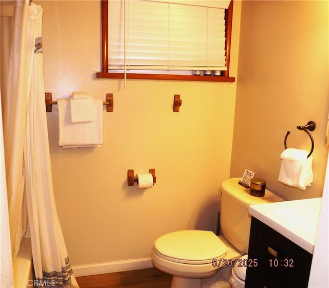 33020 Arrowbear, Running Springs, CA 92382 - full bathroom with toilet, vanity, curtained shower, wood finished floors, and baseboards