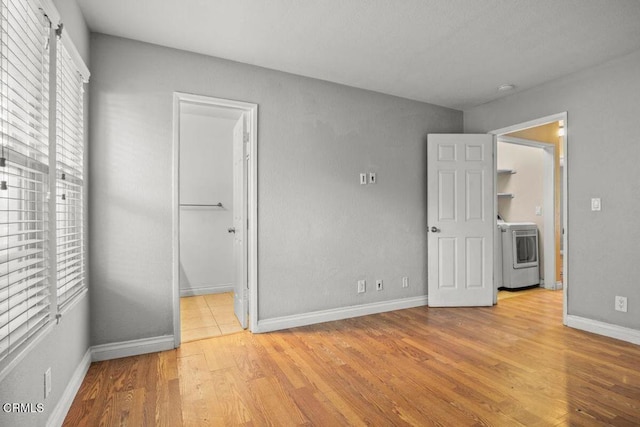 2112 Miramar Walk, Oxnard, CA 93035 - unfurnished bedroom featuring washer / clothes dryer, light wood-style flooring, and baseboards