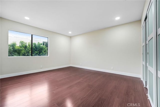 2473 Oswego St Unit 17, Pasadena, CA 91107 - unfurnished room with dark wood-style flooring, baseboards, and recessed lighting