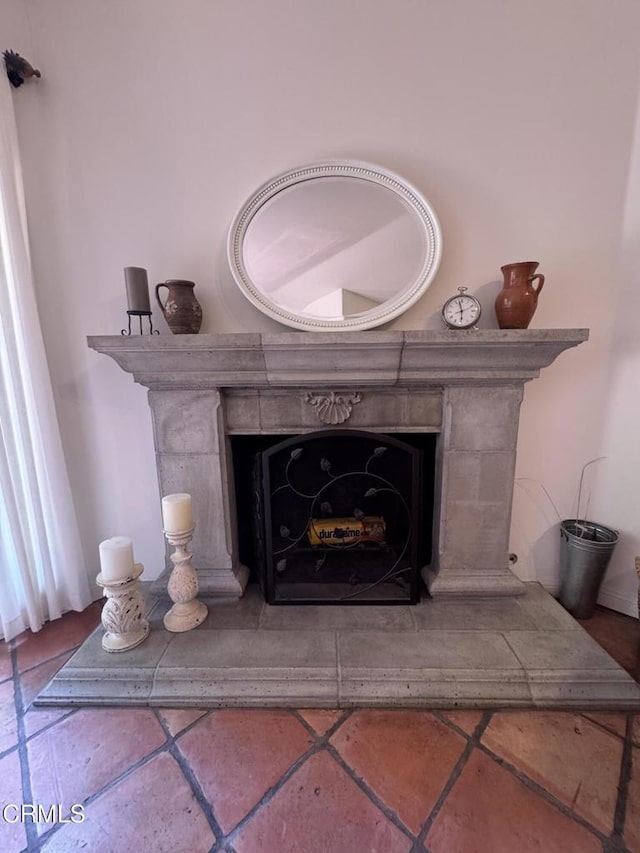 detailed view of a fireplace with raised hearth