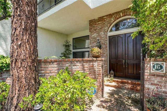 2311 Roscomare Rd Unit 16, Los Angeles, CA 90077 - property entrance with stucco siding and brick siding
