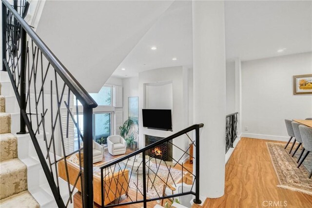 2311 Roscomare Rd Unit 16, Los Angeles, CA 90077 - stairs featuring wood finished floors and recessed lighting